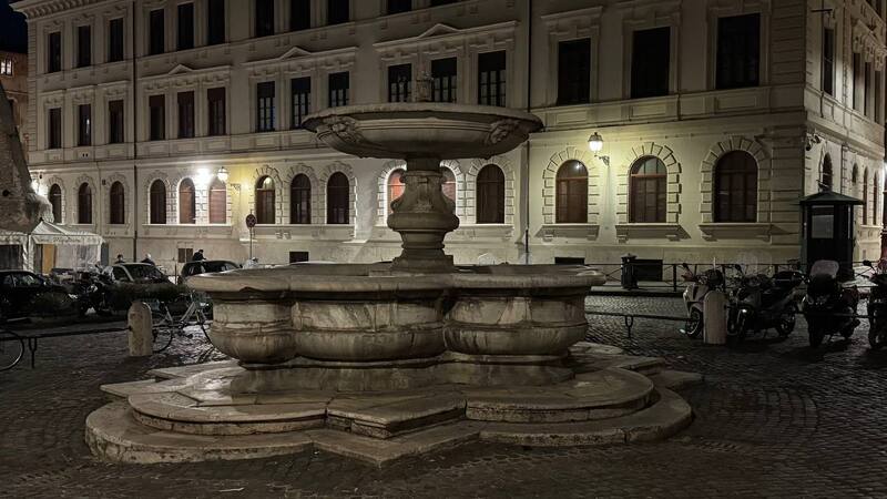 Side view of Fontana del Pianto Rome at night, located in Piazza delle Cinque Scole